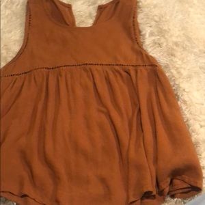 A burnt orange tank